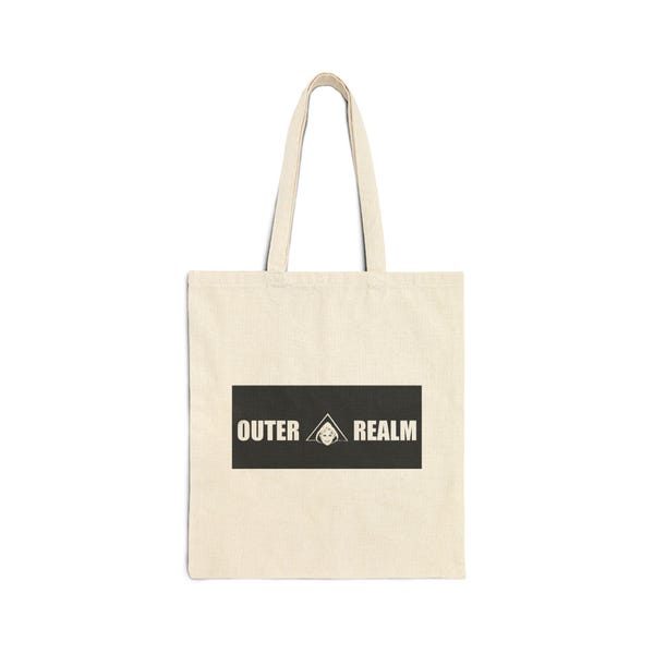 Natural canvas tote bag with the OUTER REALM logo block.
